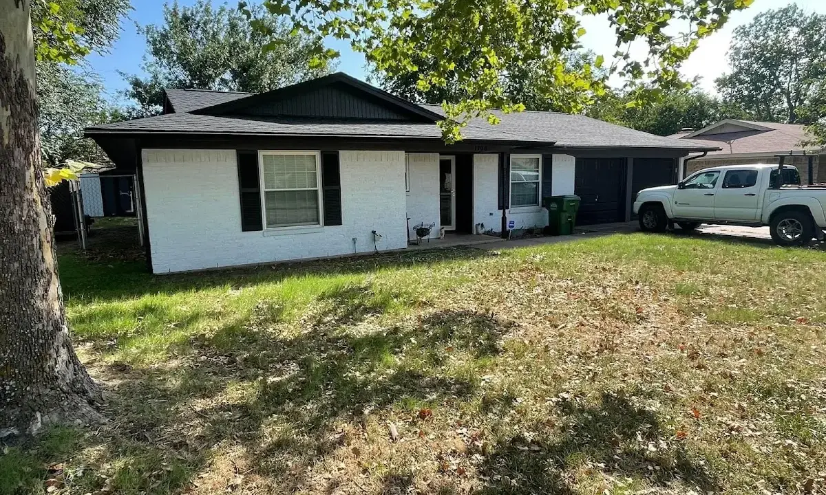 Professional roofing crew working on a residential roof in Estes Park